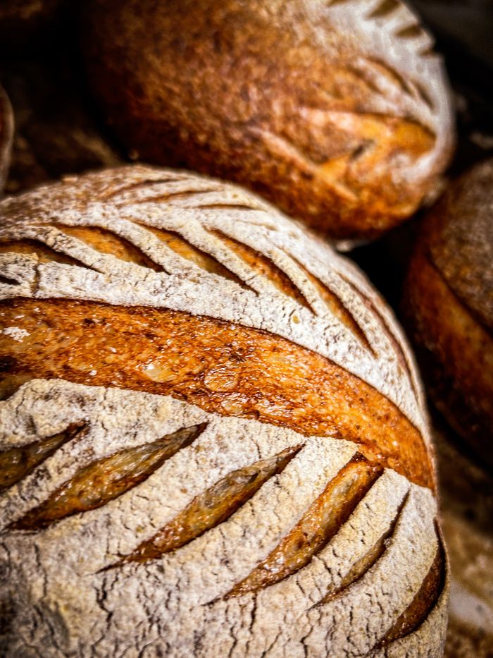 Detailed image of artisan sourdough bread with a rustic crust.